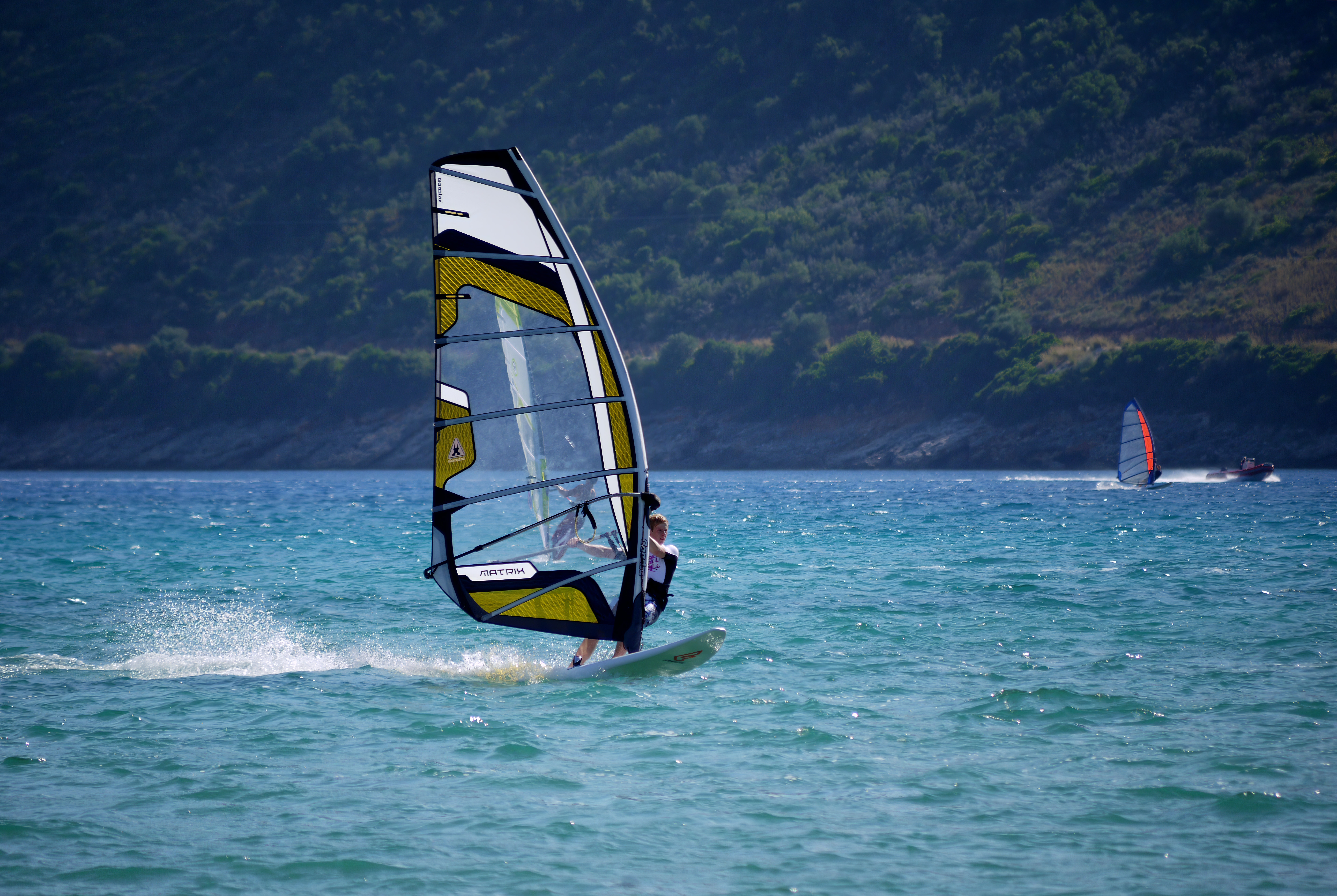 person windsurfing on the beach