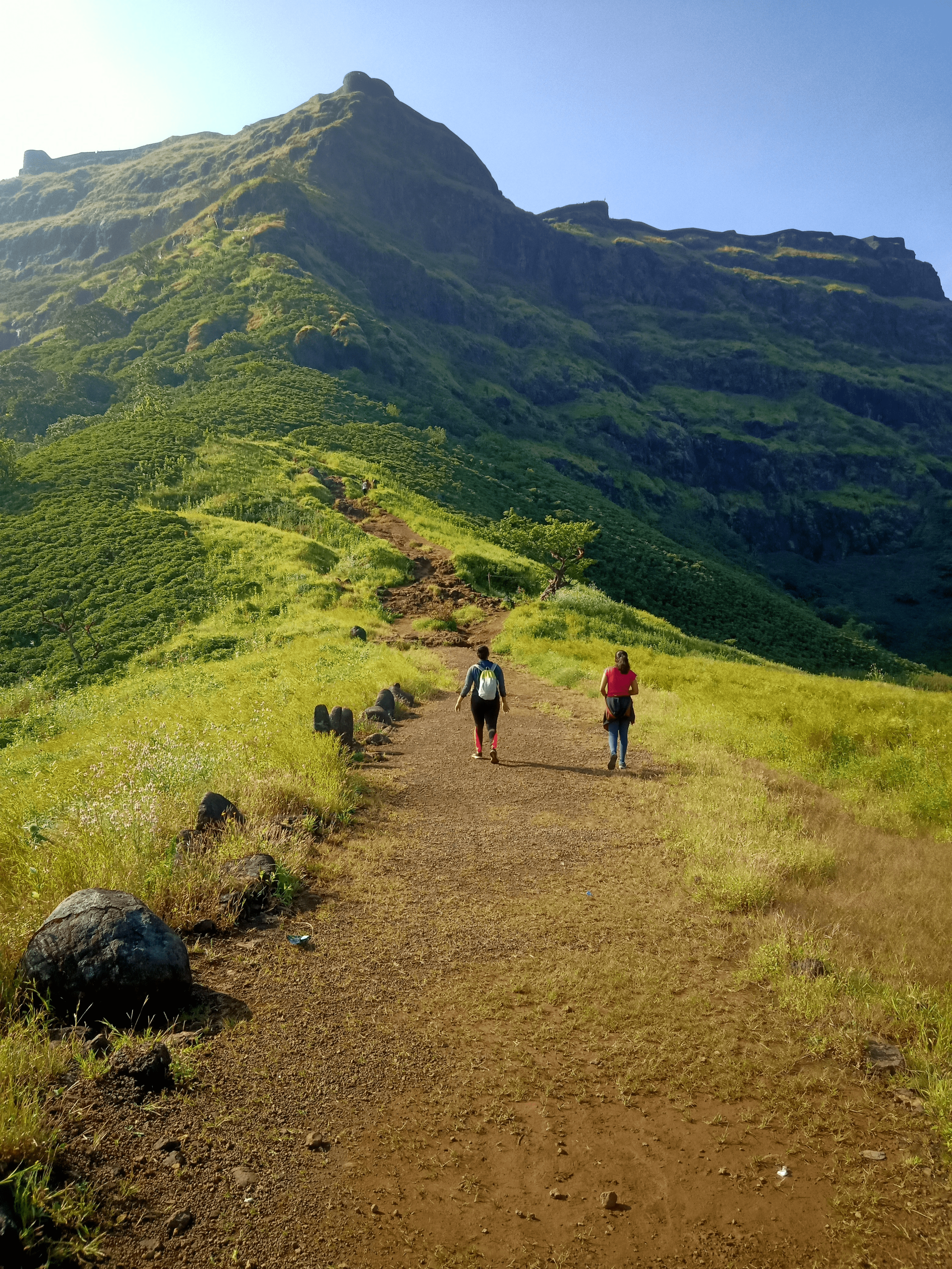 weekend getaway - trekking up a hill halfway point two persons in Igatpuri