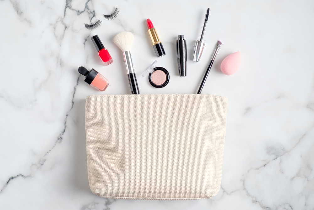 women makeup pouch with makeup essentials