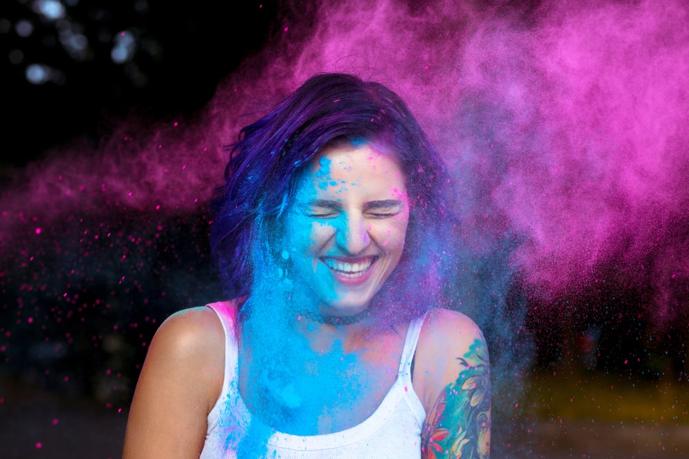 Girl getting smeared by holi colours