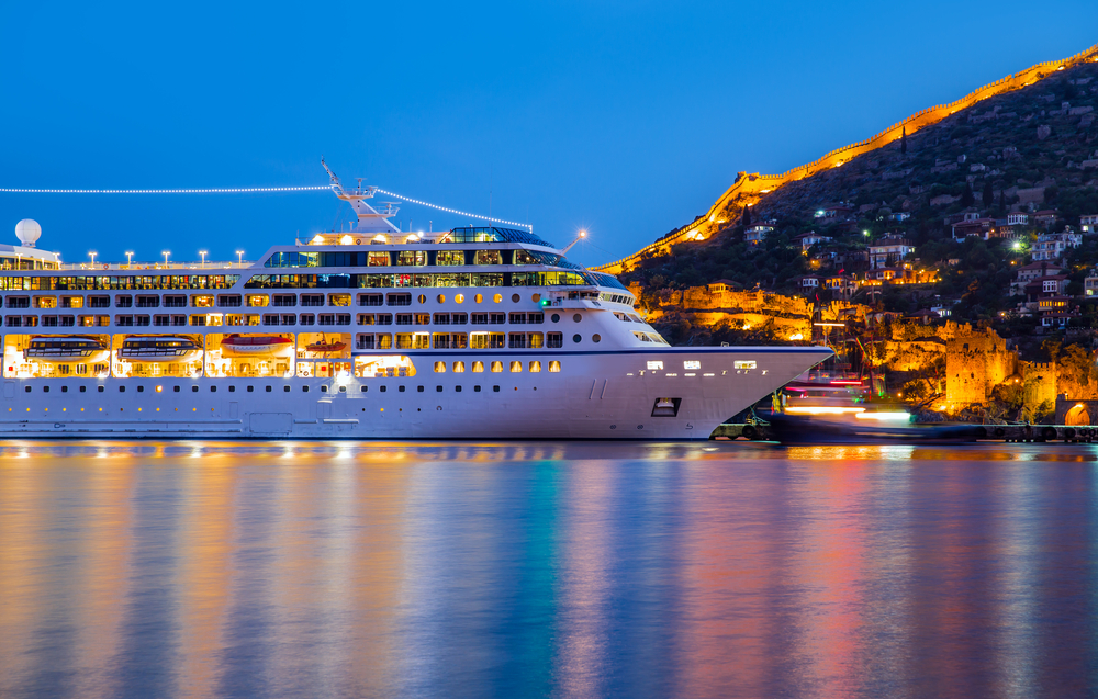 cruise liner sailing at night 