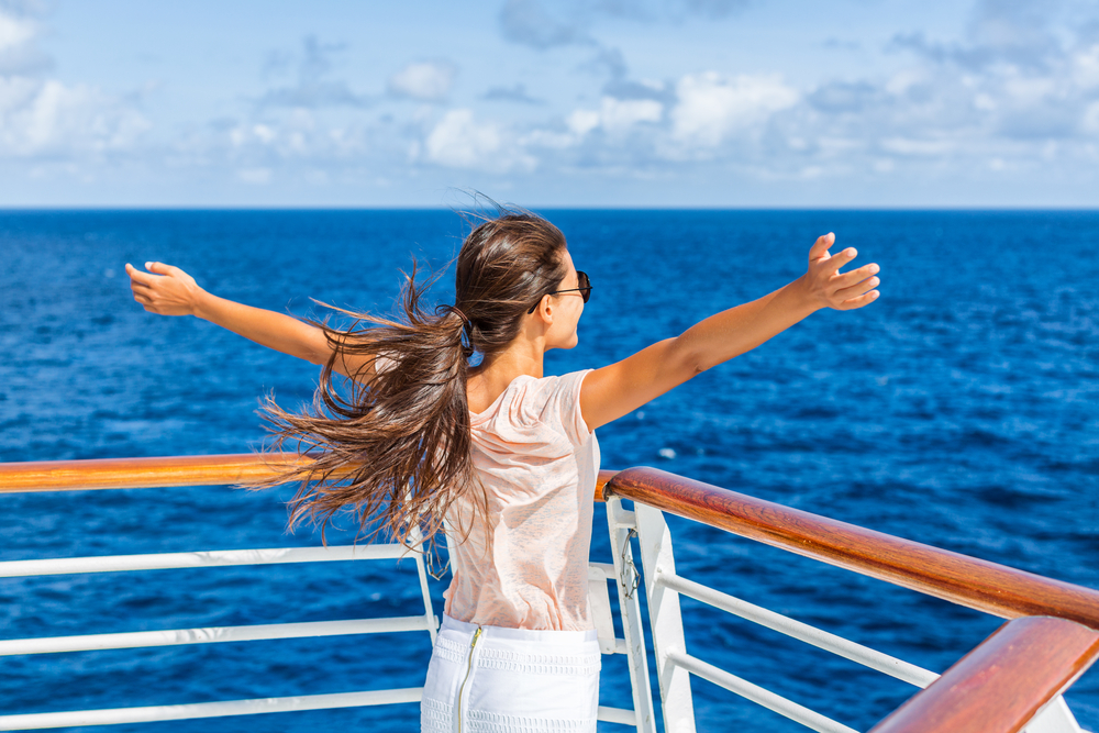 Woman enjoying the titanic pose on the cruise deck