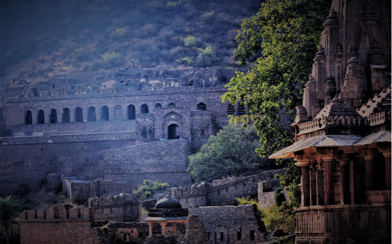 Panoramic view of a temple by the side of ruined fort, Rajasthan, India.

