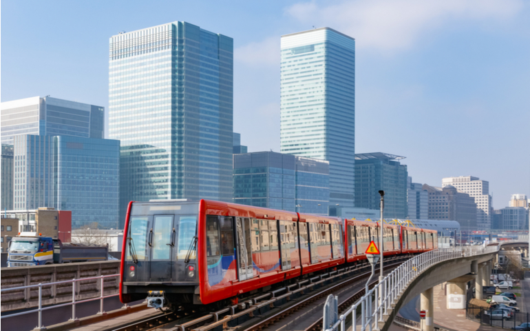 Docklands Light Railway in London with Canary Wharf in the background