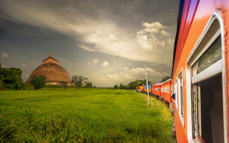 Train travels on paddy fields at Anuradhapura, Sri Lanka
