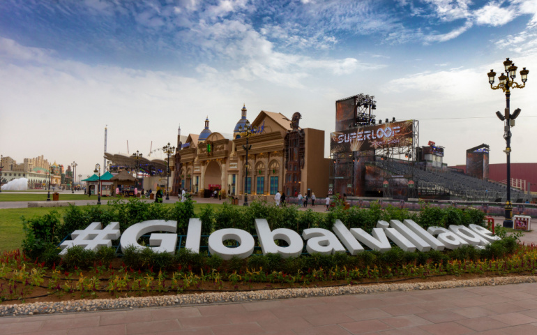 Hashtag global village sign in the center of the village