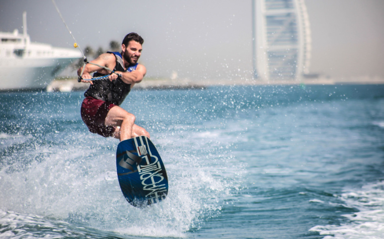 Wakeboarder enjoying a perfect day in Dubai Marina 