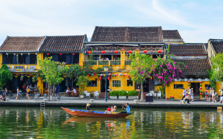Old buildings with the river in Hoi An, Vietnam. 