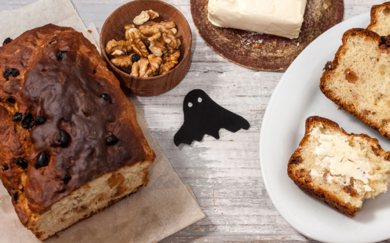 Barmbrack or bairin breac is a traditional Irish sweet yeast bread with grapes and raisins, often eaten with afternoon tea butter and traditionally served on Halloween