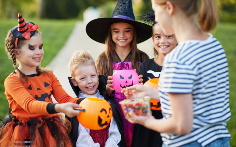 Kids in Halloween costumes during trick or treat 