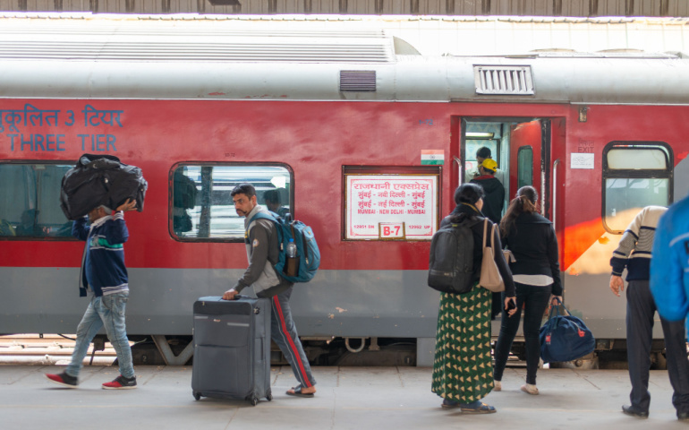 Passengers boarding Mumbai Rajdhani Express