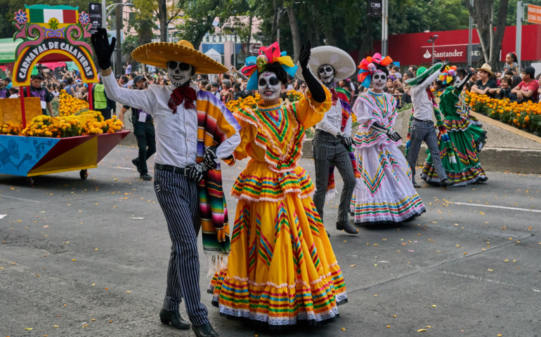 People dressed up as sugar skull and participating in Day of the dead parade in Mexico city