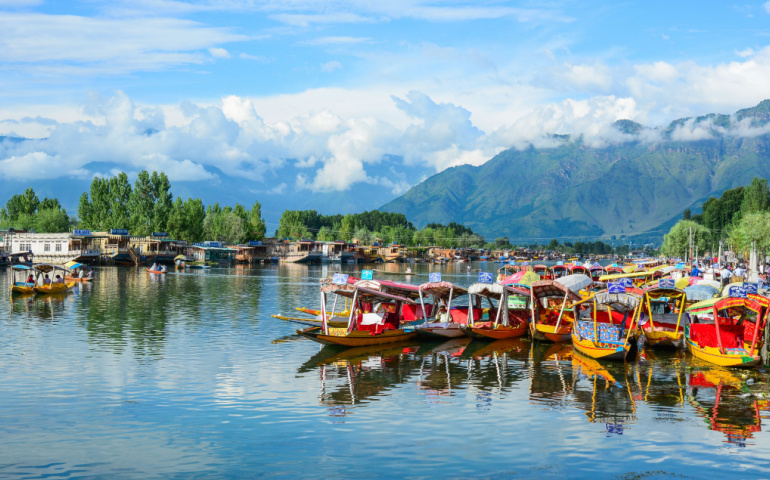 Shikaras and houseboats on Dal Lake in Srinagar. Dal lake in the northeast of Srinagar, is one of the most beautiful lakes in India.