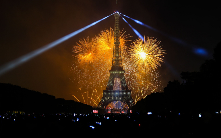 Spectators gather around to see the fireworks at the Eiffel Tower, Paris
