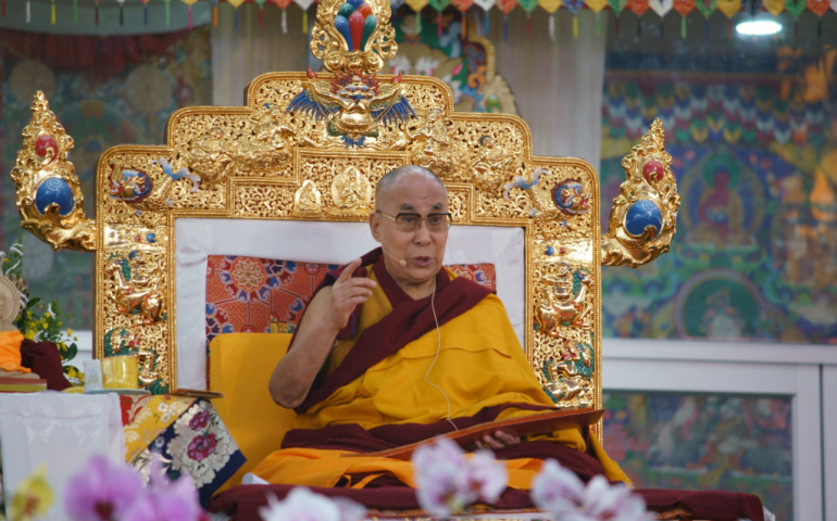 His holiness the Dalai Lama is delivering a speech to his followers
