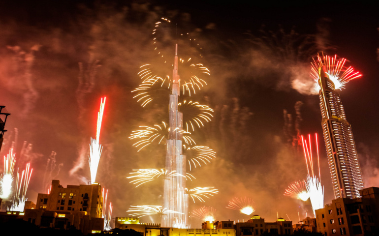 Explosion of multi-colored fireworks at Burj Khalifa Dubai against the night sky for New Year celebrations