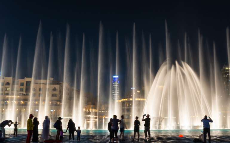  People enjoying the fountain show in Dubai at night 