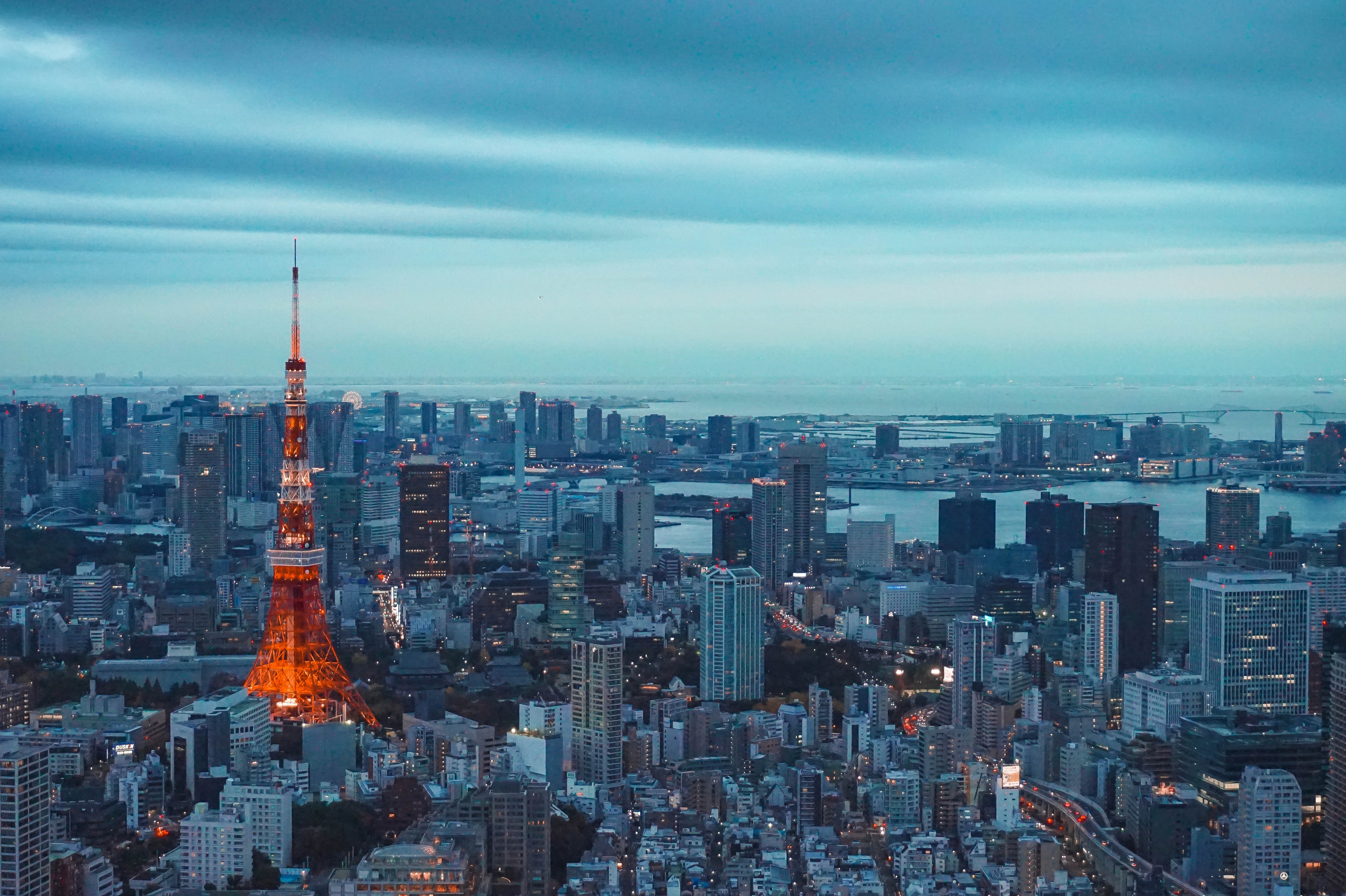 The best place to take a photo of the Tokyo Tower is at the viewing deck of Mori building in Roponggi Hills

