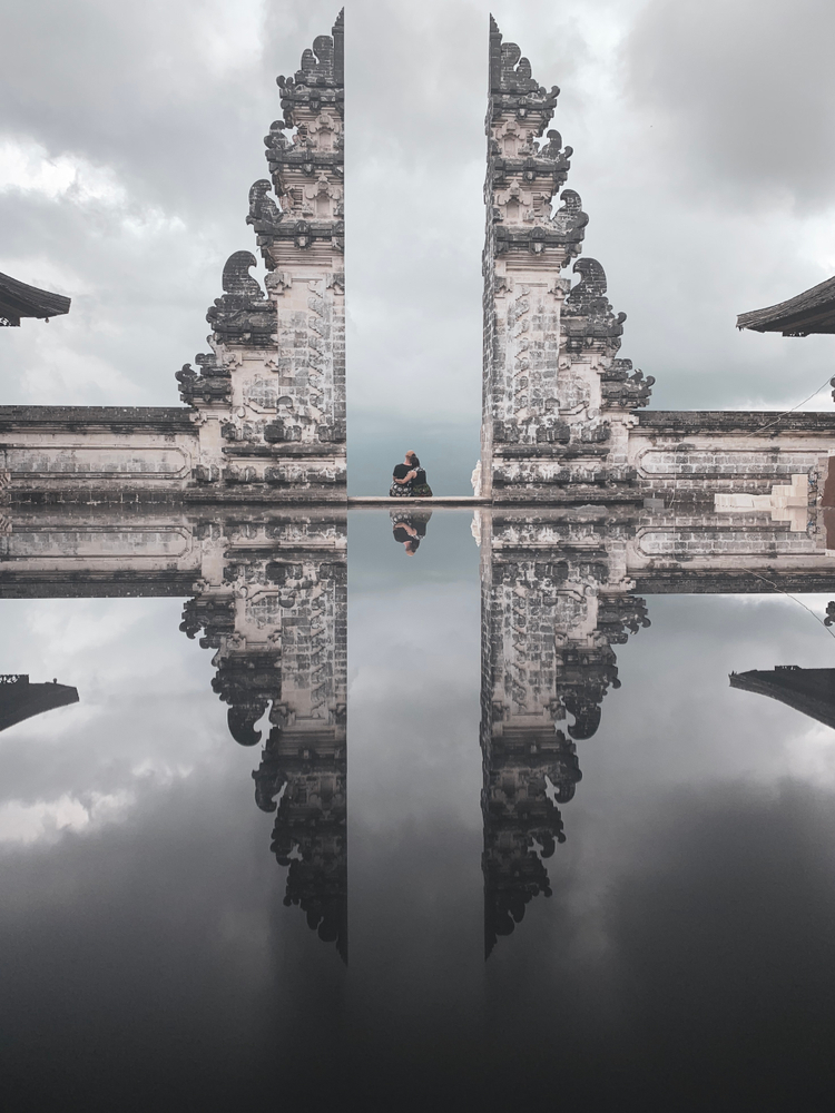 Couple sitting at the Gates of Heaven in Bali