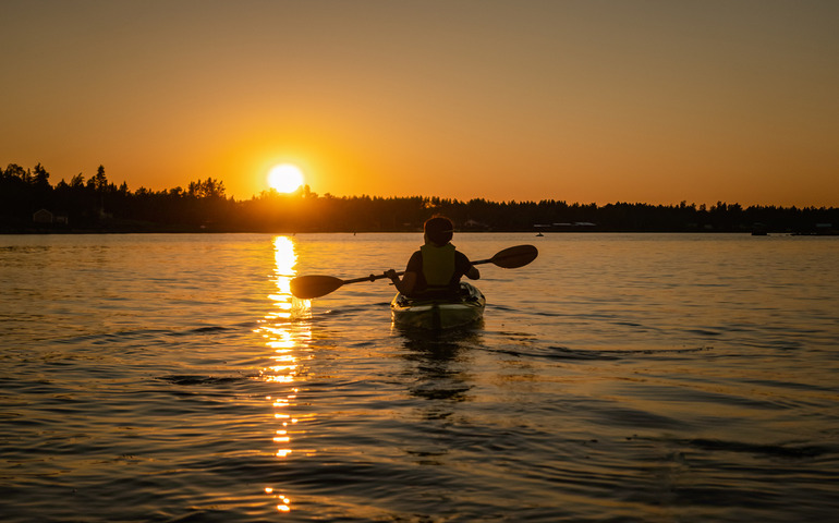 Kayaking in the midnight sun in Northern Sweden
