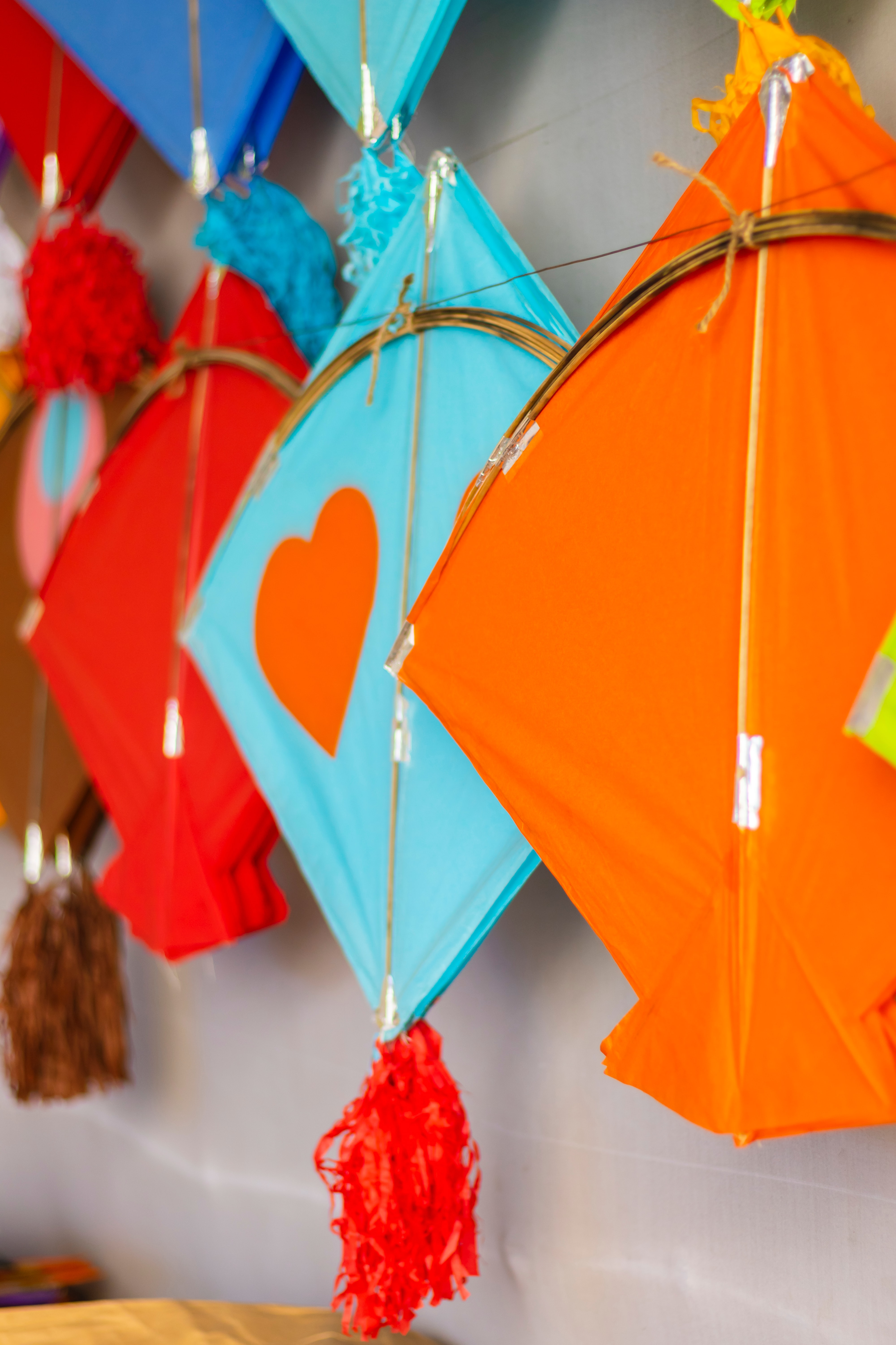 Colorful kites hanging on wall