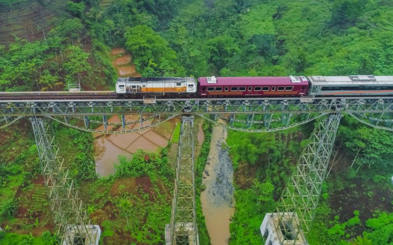Passenger Train Passing by Cikubang Bridge Longest and Oldest Active Train Bridge in Indonesia