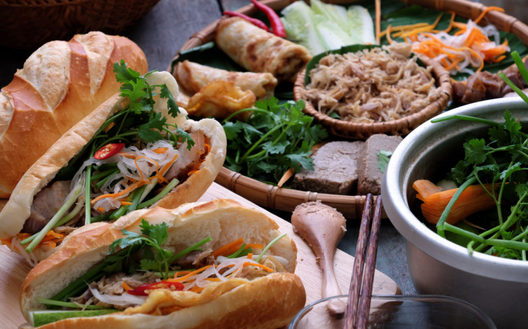 The famous Vietnamese Banh Mi  is a popular street food made from bread stuffed with pork, ham, pate, egg and fresh herbs such as scallions, coriander, carrot, cucumber, chilli.