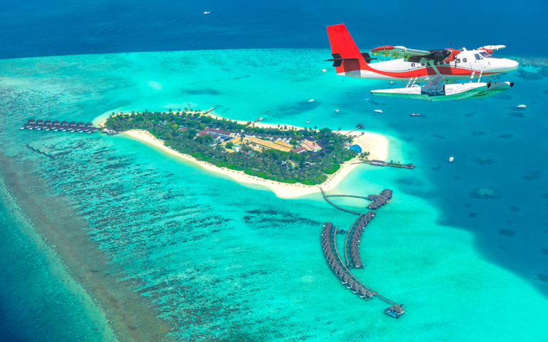 Seaplane approaching island in the Maldives