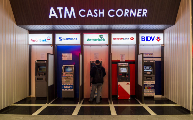 ATM cash machine units by different banks, located inside Aeon Mall, a supermarket in Vietnam.