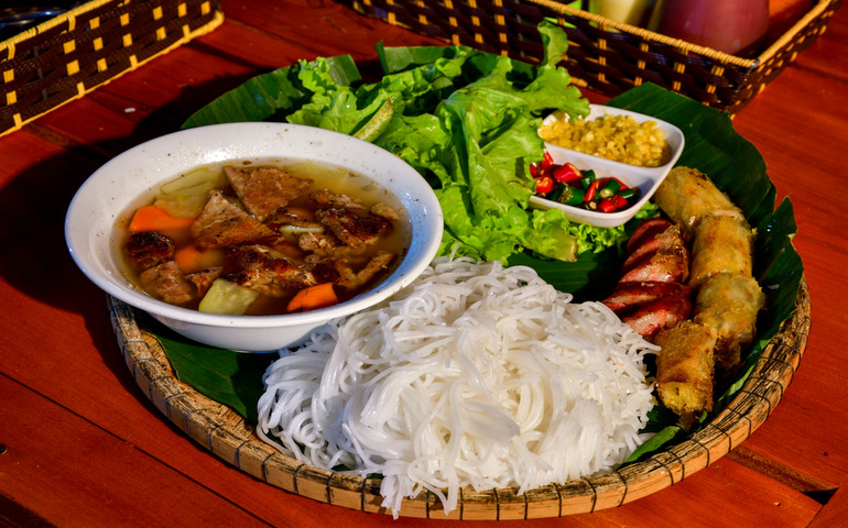 Eating traditional Vietnamese dishes- Bun Cha