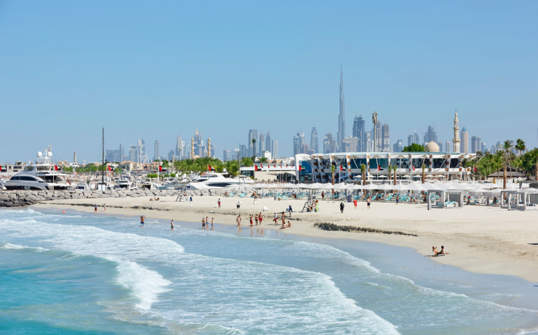 View of Jumeirah Beach with the skyline of Dubai in background 