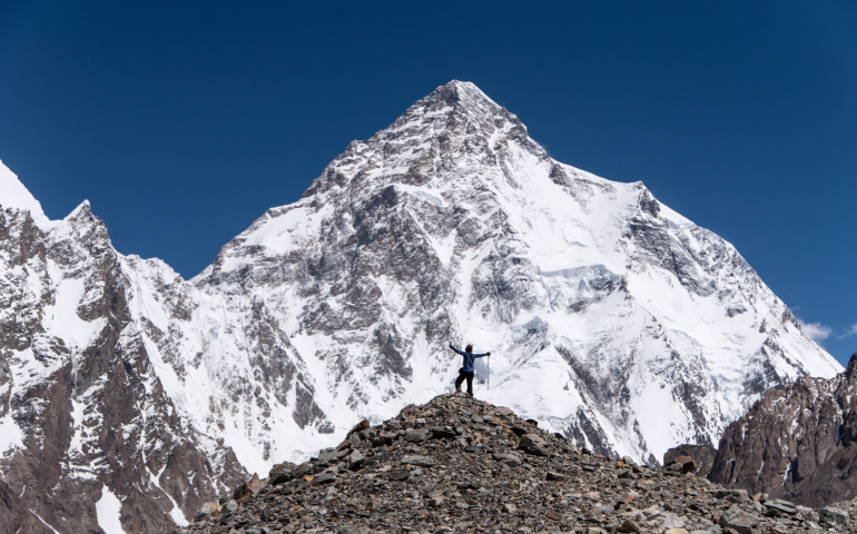View of Mount K2 with a trekker on the way to K2 Base camp, Pakistan
