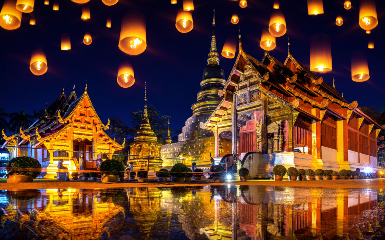 Yee peng festival and sky lanterns at Wat Phra Singh temple at night in Chiang mai, Thailand

