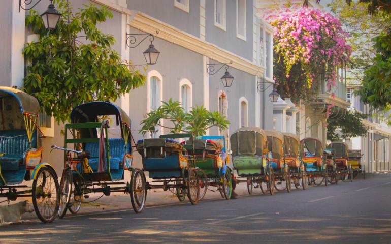 Vintage tricycle carts on French style street in Pondicherry.
