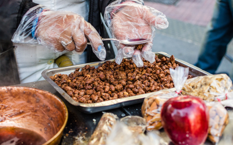 Cooking of garrapinada caramelized peanuts at a weekend fair in San Telmo neighborhood, Buenos Aires