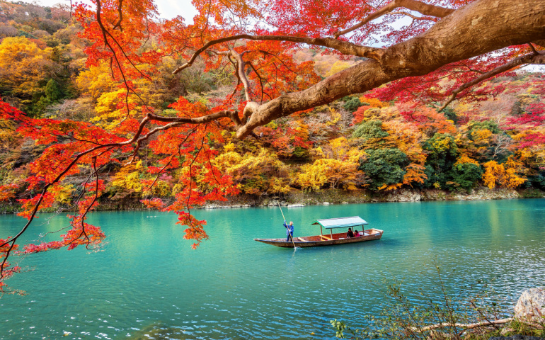 Arashiyama in autumn season along the river in Kyoto, Japan
