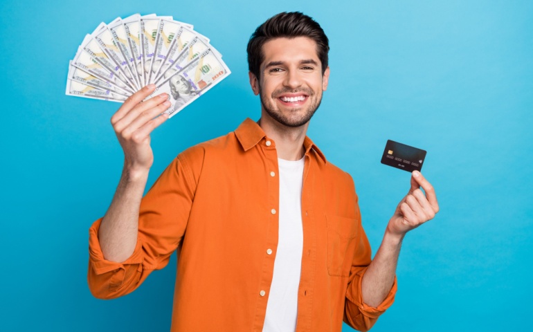 A man showing card and cash