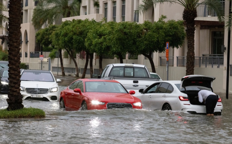 Flooded streets of a residential community in Dubai during a heavy downpour.
