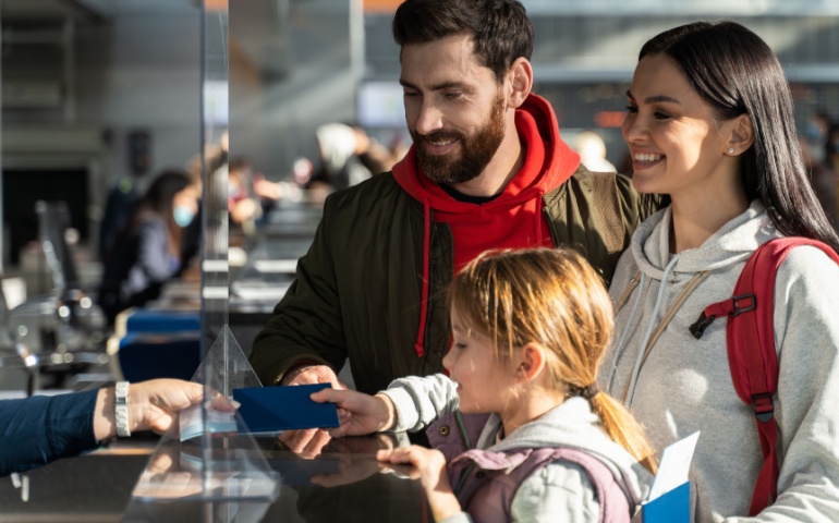 Passengers checking in at the airport for their flight
