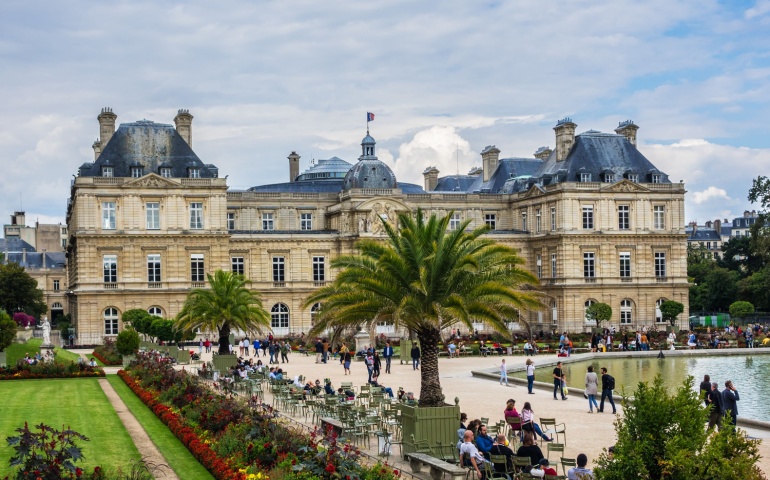 Tourists and Parisians relaxing in Luxembourg Garden. Jardin du Luxembourg - second largest Public Park in Paris.
