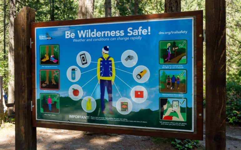 View of sign to be wilderness safe during travel. 
