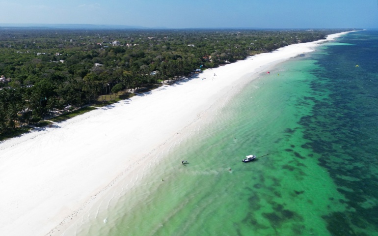 Amazing Diani beach seascape with white sand and turquoise Indian Ocean, Kenya top view.
