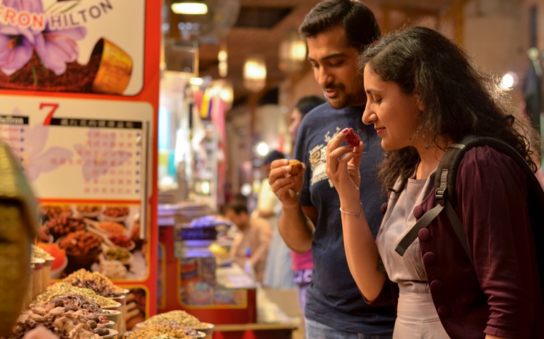 Tourists buying spices in Dubai