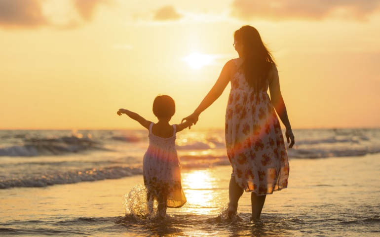 Mother and daughter on the beach