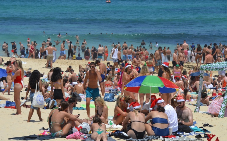 Tourists celebrating Christmas on Bondi Beach