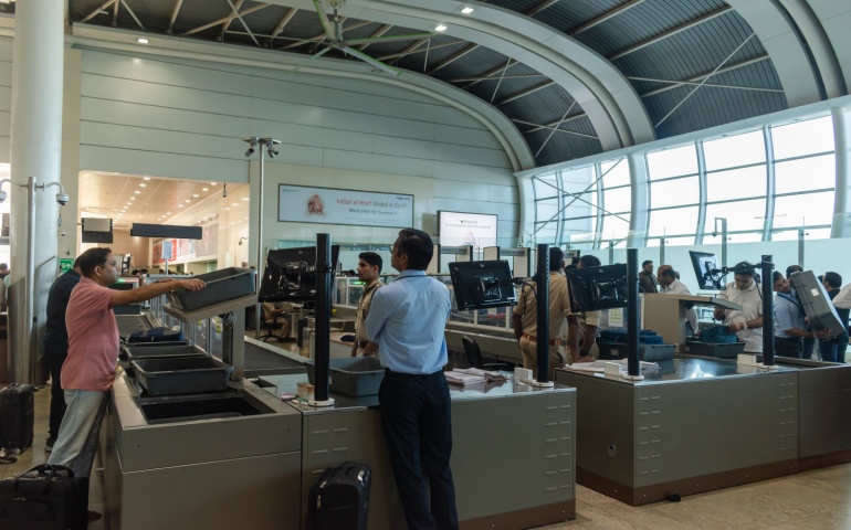 Passengers at security checks in the Terminal