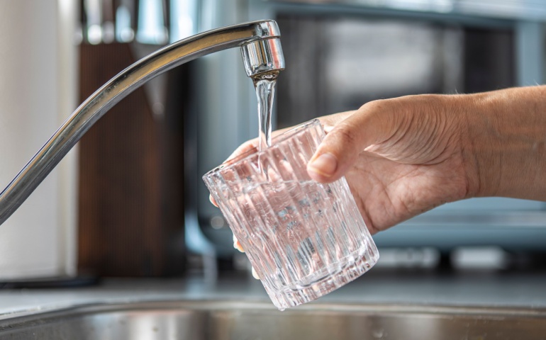 Glass being filled with tap water