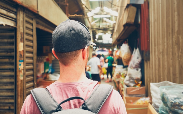 Backpacker exploring a backstreet in Malaysia