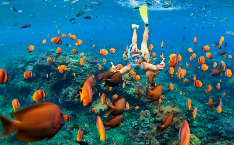 Girl snorkeling at Maldives