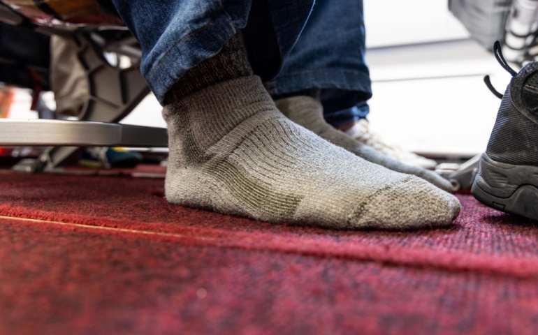 Passenger removed shoes in cabin to relax